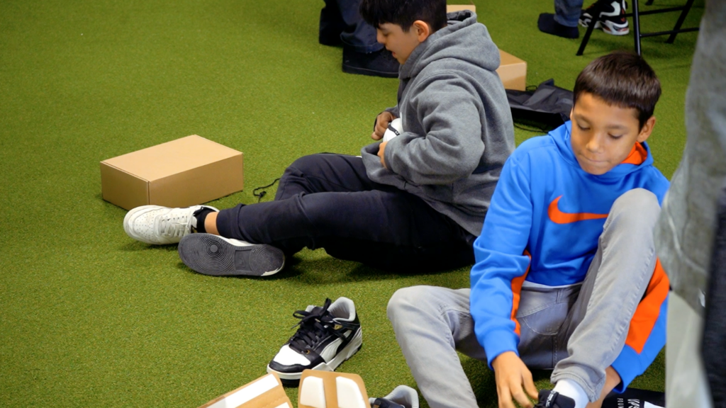 UPSWING athletes getting shoes